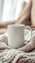 White Coffee Mug on Cozy Knitted Blanket in Soft Natural Light