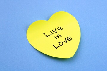 Live in love phrase on sticky note
