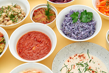 A Colorful Array of Vegetarian Dishes Showcasing Fresh Ingredients and Diverse Flavors Served in Bowls on a Bright Surface