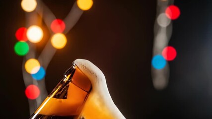 Close-up shot of a beer bottle with overflowing foam and bokeh lights in the background. - Powered by Adobe