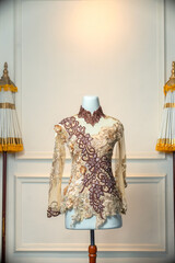 Elegant long sleeve wedding dress featuring intricate floral embroidery with a combination of beige...