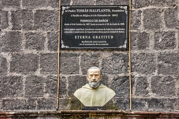 Banos De Agua Santa, Ecuador: Bust of Father Tomas Halflants displayed on stone wall with plaque,...