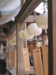 Japanese glass furin wind chimes hanging at a Shinto shrine in summer