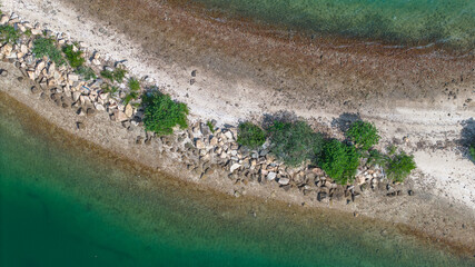 View of a Scenic Peninsula with Greenery and Clear Blue Waters