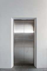 Shiny stainless steel surface on elevator door, reflecting clean and modern design. Concept of...