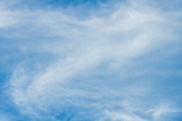 High cloud in the blue afternoon sky