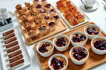 A Delightful Spread of Assorted Desserts Featuring Creamy Puddings, Fruit Tarts, and Delicious Sweets Perfect for Any Celebration or Gathering