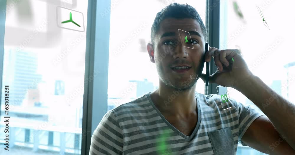 Poster tech engineer bringing smartphone to ear, initiating holographic data panels while analyzing call
