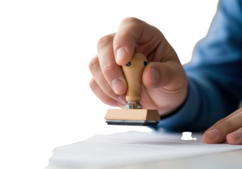 Hand holding a rubber stamp to mark a document isolated on transparent background