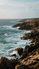 Rugged Coastal Landscape with Waves Crashing Against Rocky Shores