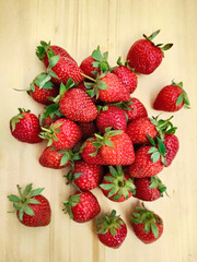 Organic Strawberries on Rustic Wooden Surface