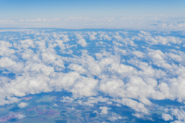 view of the sky with clouds from an airplane window