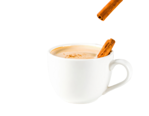 Coffee Shop Seasonal Drink with Cinnamon Stick and Cream Splash mid-Air on white surf