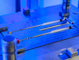 Metal molds for plastic injection molding in a manufacturing facility, showcasing precise design...
