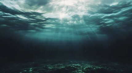 Fototapeta premium Underwater view of ice sheet with sunlight filtering through the ice.