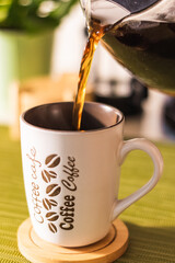 Coffee mug with the words Coffee Cafe written on it
