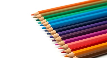 Fototapeta premium Set of colored pencils arranged in parallel, white background.