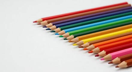 Set of colored pencils arranged in parallel, white background.