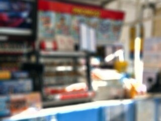 Defocused abstrack background of minimarket or convenience store in the afternoon