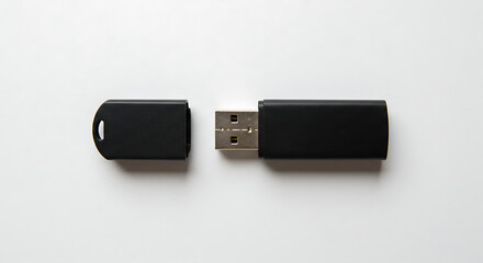 Minimalist mockup of a black USB flash drive with its cap off, isolated on a clean white background for corporate branding.