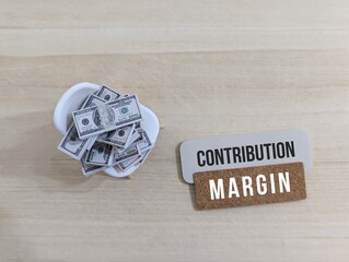 Contribution Margin and Financial Concept with Dollar Bills