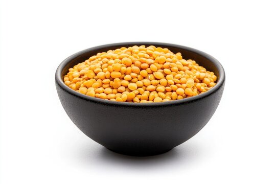 Product photo of arhar dal in a black bowl, on a white background, front view