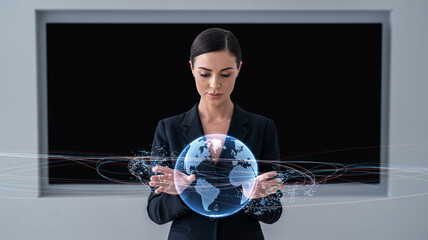 Woman holding a holographic Earth with digital data streams in front of a screen globe