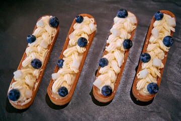 Deliciously Decorated Treats Showcasing Creamy Frosting and Fresh Blueberries on a Crisp Pastry...