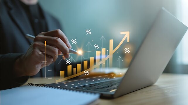 Business professional analyzing financial growth charts and data on a laptop with glowing holographic projections of success and progress