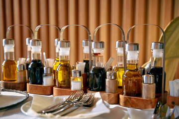A Beautiful Display of Condiments Featuring Various Oils, Vinegars, and Seasonings Ready for a...