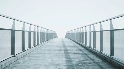 A long, narrow, gray metal bridge with a white sky in the background.
