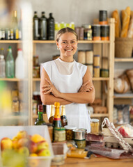 Female employee near store counter and waits for visitors. Seller wants to sell large amount of...