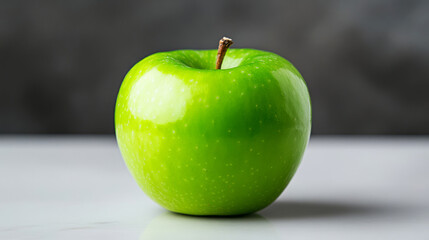 Fresh and Crisp Green Apple on White Countertop with Grey Background and Natural Lighting