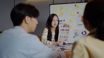 Asian businesswoman startup presenting data chart project management meeting with colleagues, financial report analysis teamwork strategy plan corporate success at office, marketing, data analytics - Powered by Adobe