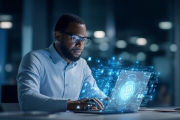 A focused man wearing glasses interacts with a futuristic holographic digital interface projected from his laptop.