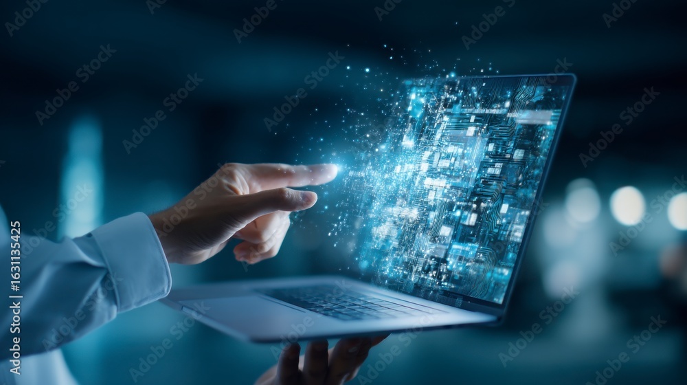 Poster a hand interacts with a laptop displaying a futuristic digital interface with glowing data and holog