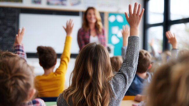 Students enthusiastically raise their hands in a classroom during a lesson with their teacher near the chalkboard - Powered by Adobe