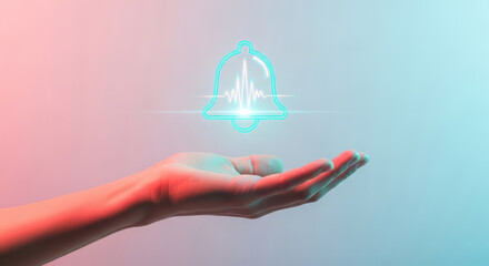 Hand holding a glowing digital notification bell icon with light effects