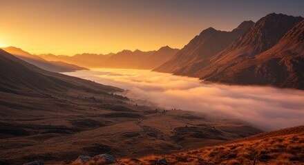 Fototapeta premium Golden Hour Mountainscape: Dramatic Fog-Filled Valley, Sunset Light, Serene Landscape.