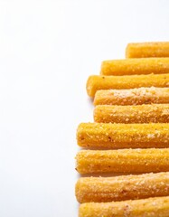 Fototapeta premium Close Up of Crunchy Golden Sticks Snacks Arranged on White Background
