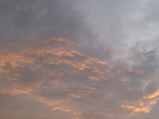 A breathtaking sky with soft orange light