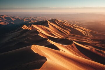 Golden Hour Over Namib Desert Dunes: Aerial View of Sand Ridges and Horizon