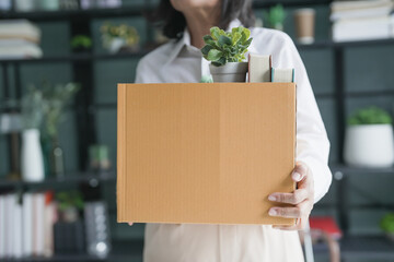 Quit Job senior asian business woman sending resignation letter and packing Stuff Resign Depress or...