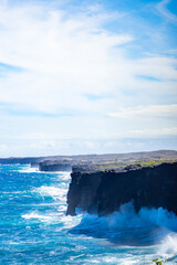 Powerful Ocean Waves Crash Against the Hōlei Sea Arch and Volcanic Lava Cliffs in Hawaii Volcanoes...