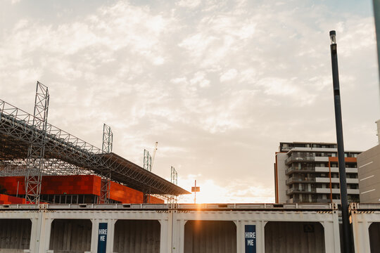 Covered portable walkway made from shipping containers beside Newcastle station