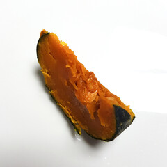  A series of images showing pieces of steamed pumpkin. The photos highlight the soft, flaky texture...