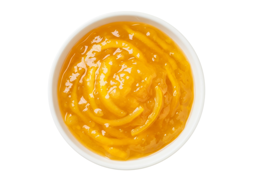 A white ceramic bowl filled with vibrant yuzu fruit marmalade, white background isolated