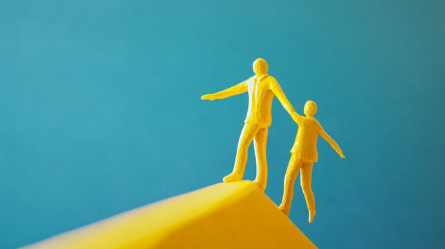 Yellow figures walk a yellow edge against a blue background  supporting each other