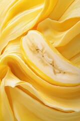 Close-up of vibrant yellow gelato, with a sliced banana