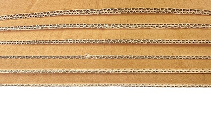 A stack of textured and corrugated cardboard. Cardboard surfaces stacked in rows and layers....